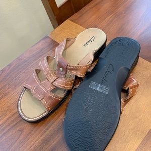 Clark’s brown leather upper sandals.
